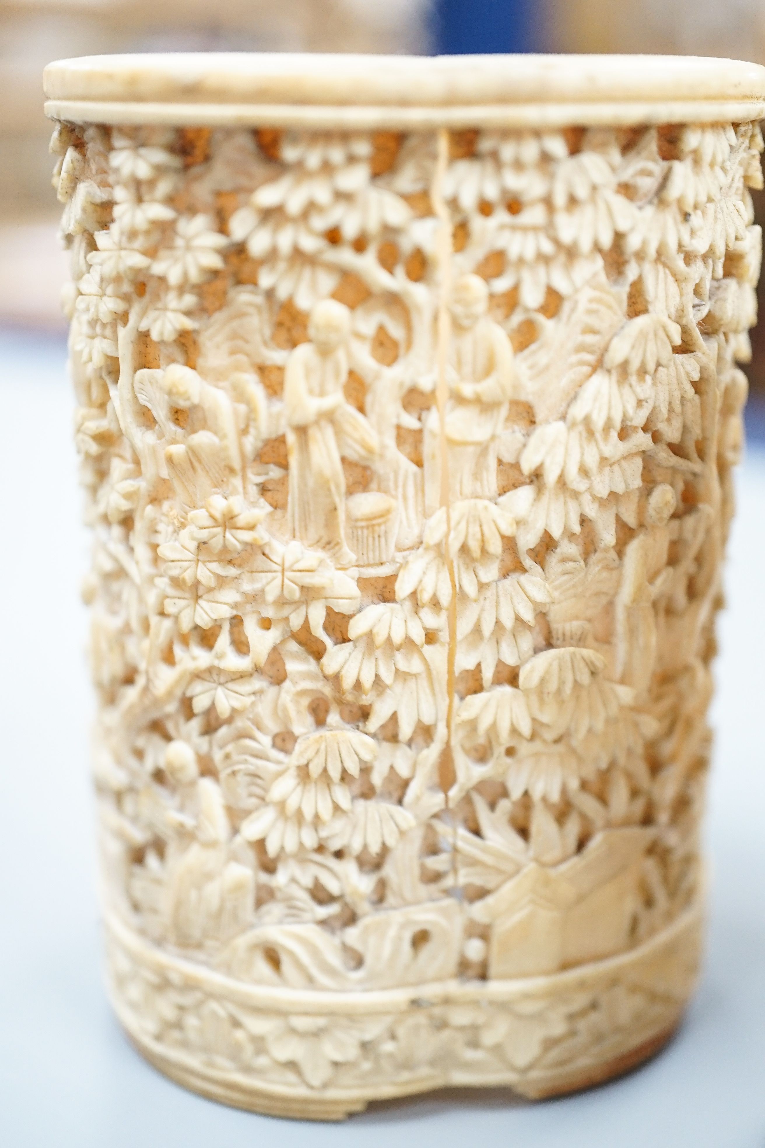A pair of Chinese carved ivory pots and a Chinese ivory circular box and cover, 19th century